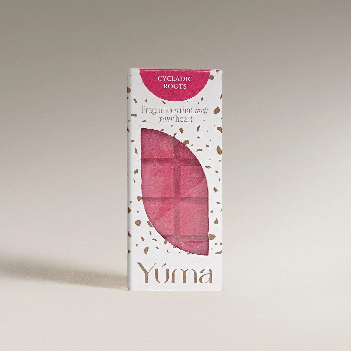Ροζ wax melts Cycladic Roots της YUMA σε λευκή συσκευασία με καφέ λεπτομέρειες και άνοιγμα.